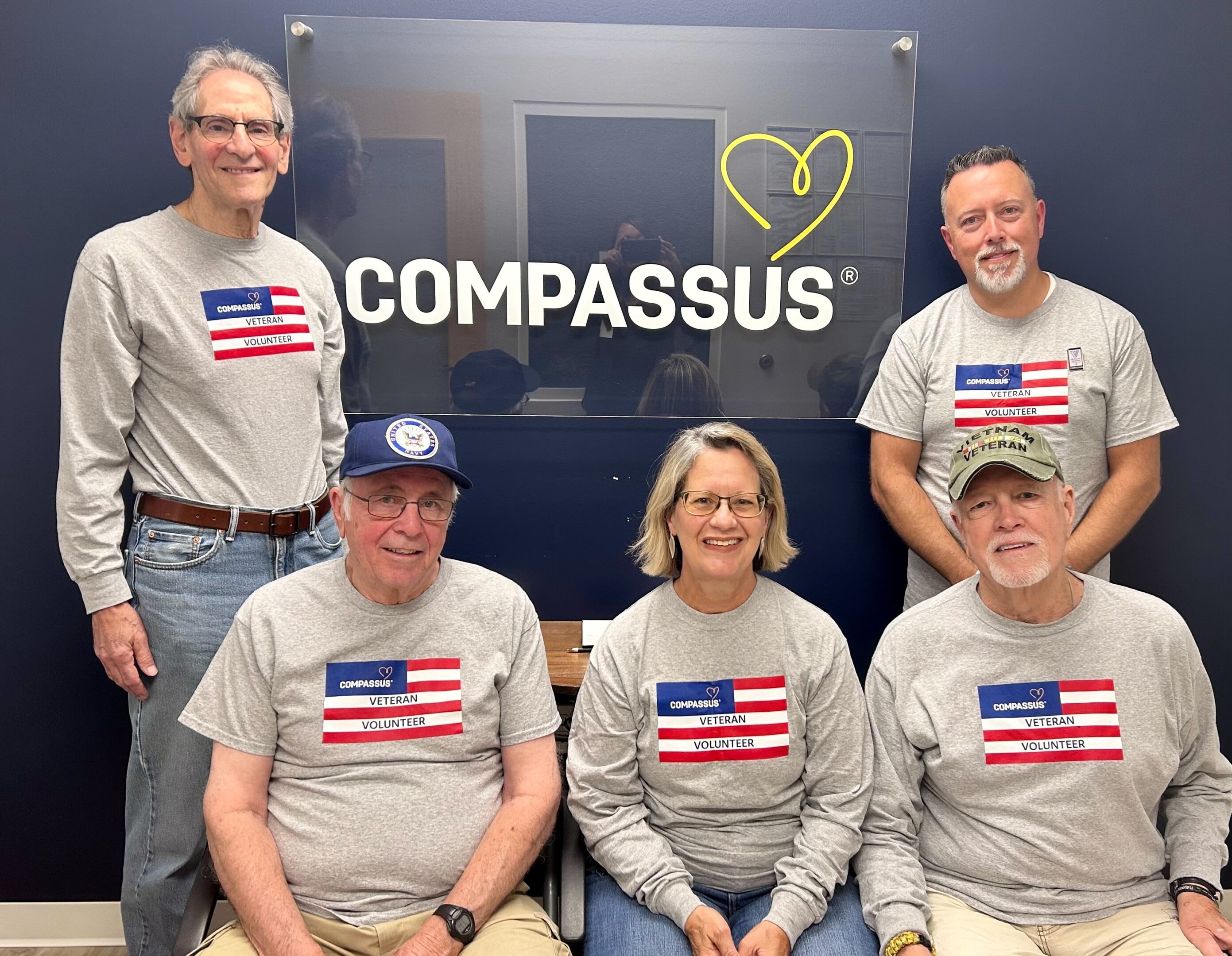 Compassus veteran volunteers at community event