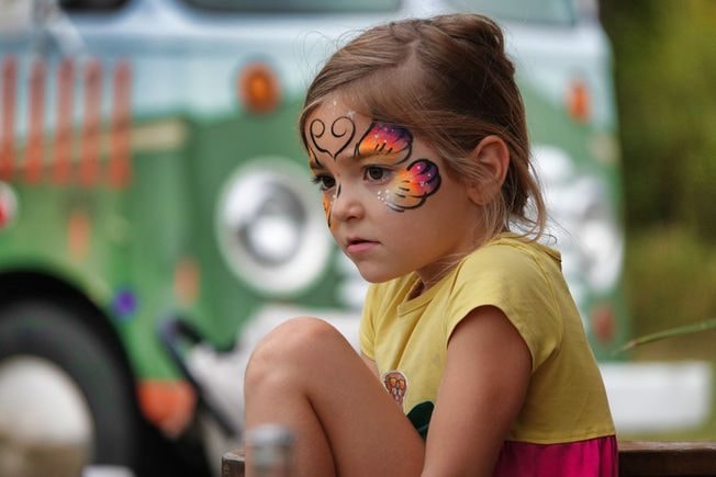 Girl with face paint at Farm Day